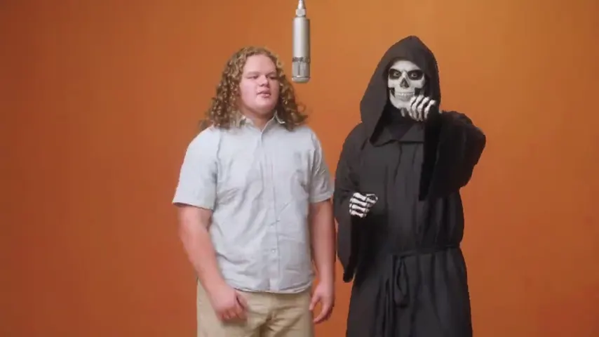 A young man splitting the mic with the grim reaper